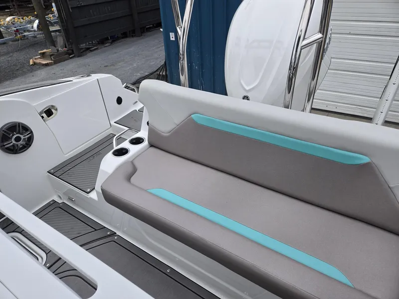 Slide: The Image of 2025 Hurricane Center Console 24 OB boat interior with gray and teal seating. - 24
