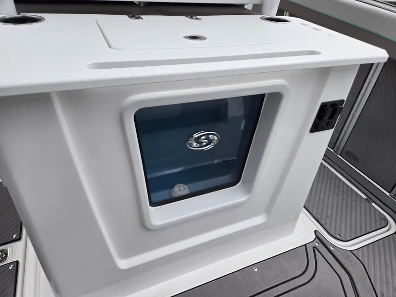 Slide: The Image of 2025 Hurricane Center Console 24 OB boat interior detail with storage compartment. - 26