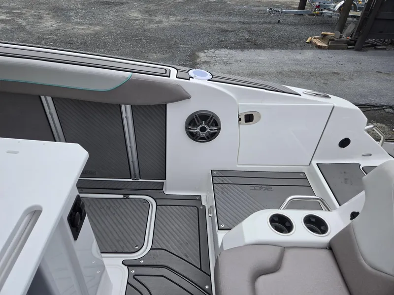 Slide: The Image of 2025 Hurricane Center Console 24 OB interior with seating and cup holders. - 27
