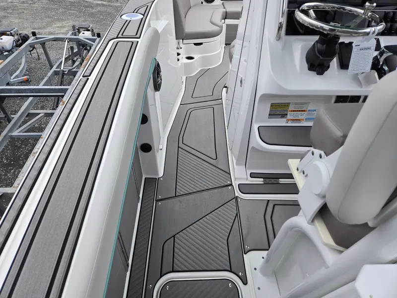 Slide: The Image of 2025 Hurricane Center Console 24 OB boat interior with sleek design and modern features. - 28