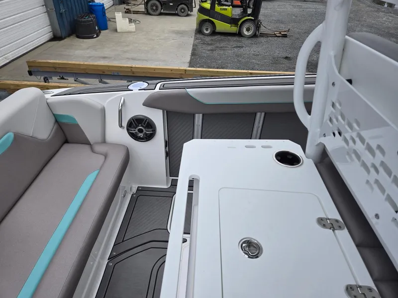 Slide: The Image of 2025 Hurricane Center Console 24 OB boat interior with seating and storage. - 31