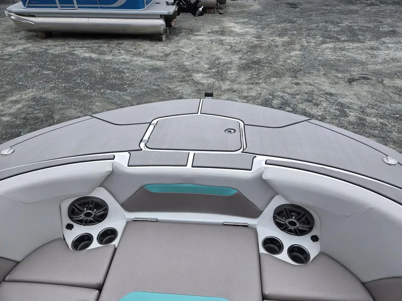 Slide: The Image of 2025 Hurricane Center Console 24 OB boat interior with speakers and seating. - 43