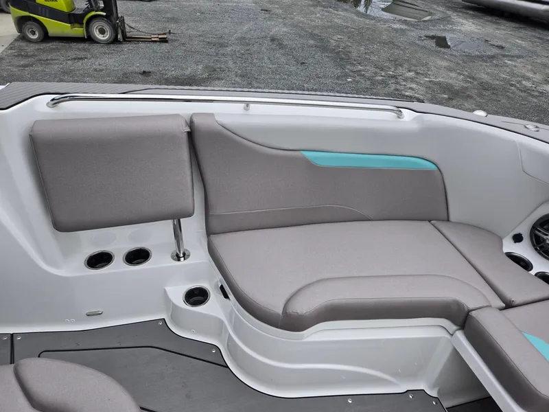 Slide: The Image of 2025 Hurricane Center Console 24 OB boat interior with gray seating and cup holders. - 44