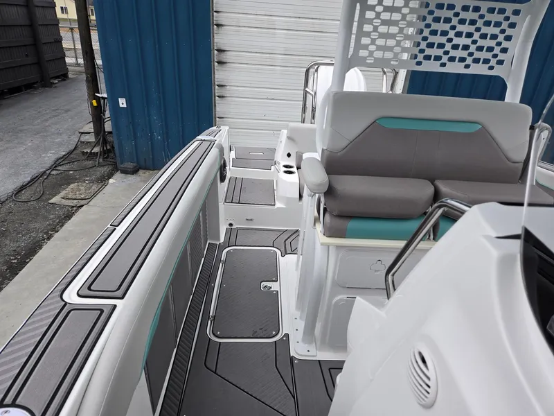 Slide: The Image of 2025 Hurricane Center Console 24 OB boat interior with seating and deck details. - 45
