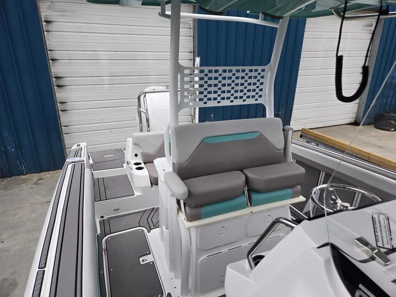 Slide: The Image of 2025 Hurricane Center Console 24 OB boat interior with modern seating and console design. - 46