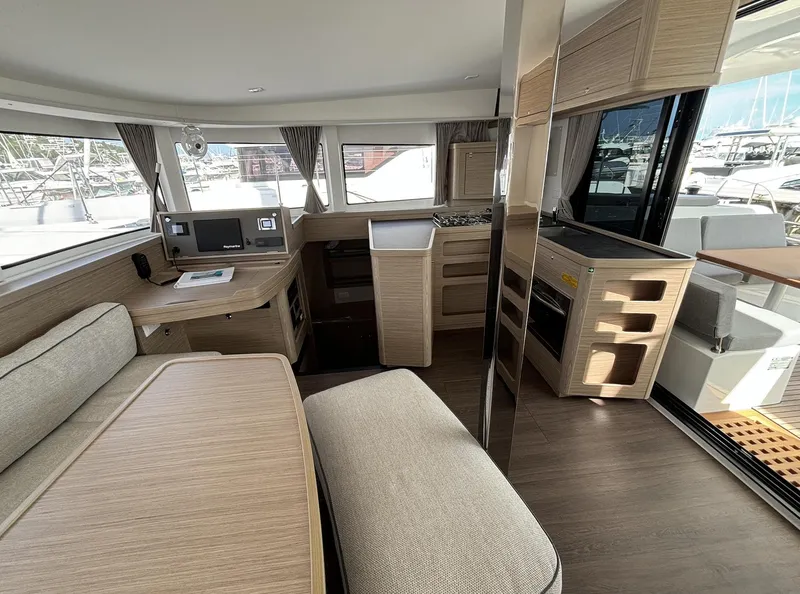 Slide: The Image of Modern interior of 2025 Lagoon 42 catamaran with sleek wood finishes and spacious layout. - 14