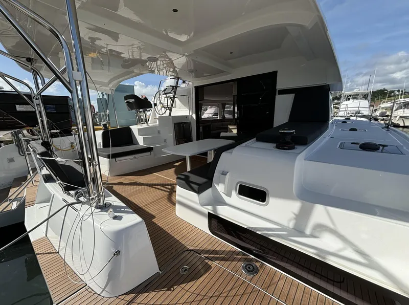 Slide: The Image of 2025 Lagoon 42 catamaran with spacious deck and modern seating area. - 20