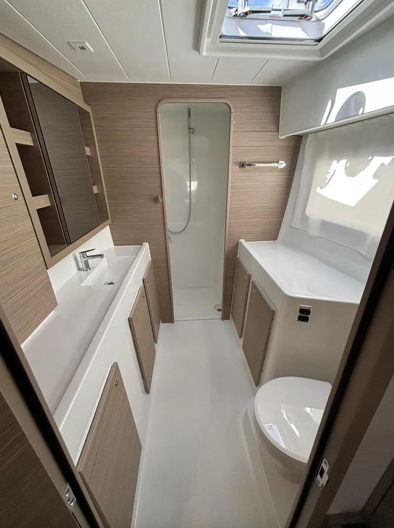 Slide: The Image of Modern bathroom interior of 2025 Lagoon 42 yacht with sleek design and natural lighting. - 24