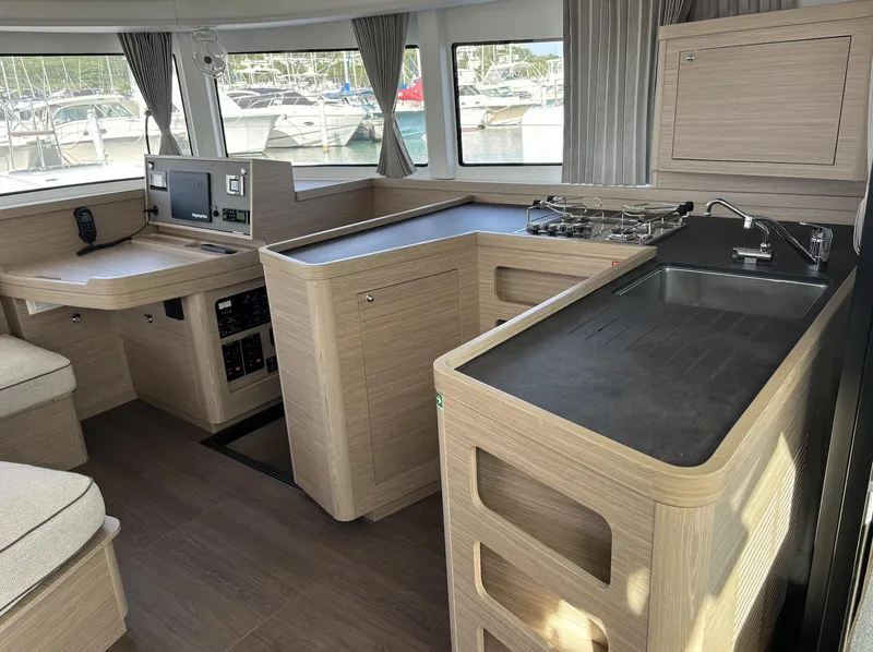 Slide: The Image of Modern interior of 2025 Lagoon 42 catamaran with sleek kitchen and navigation area. - 5