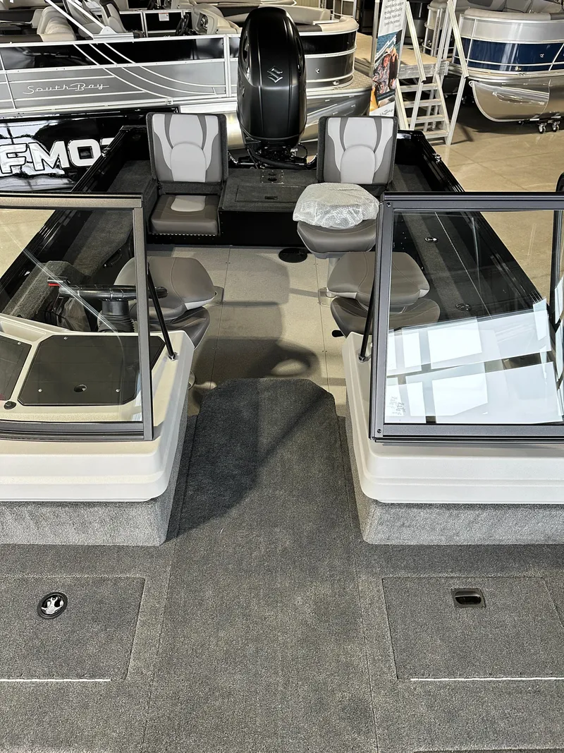 Slide: The Image of 2025 Smoker Craft Adventurer 188 DC boat interior with seating and windshield. - 1