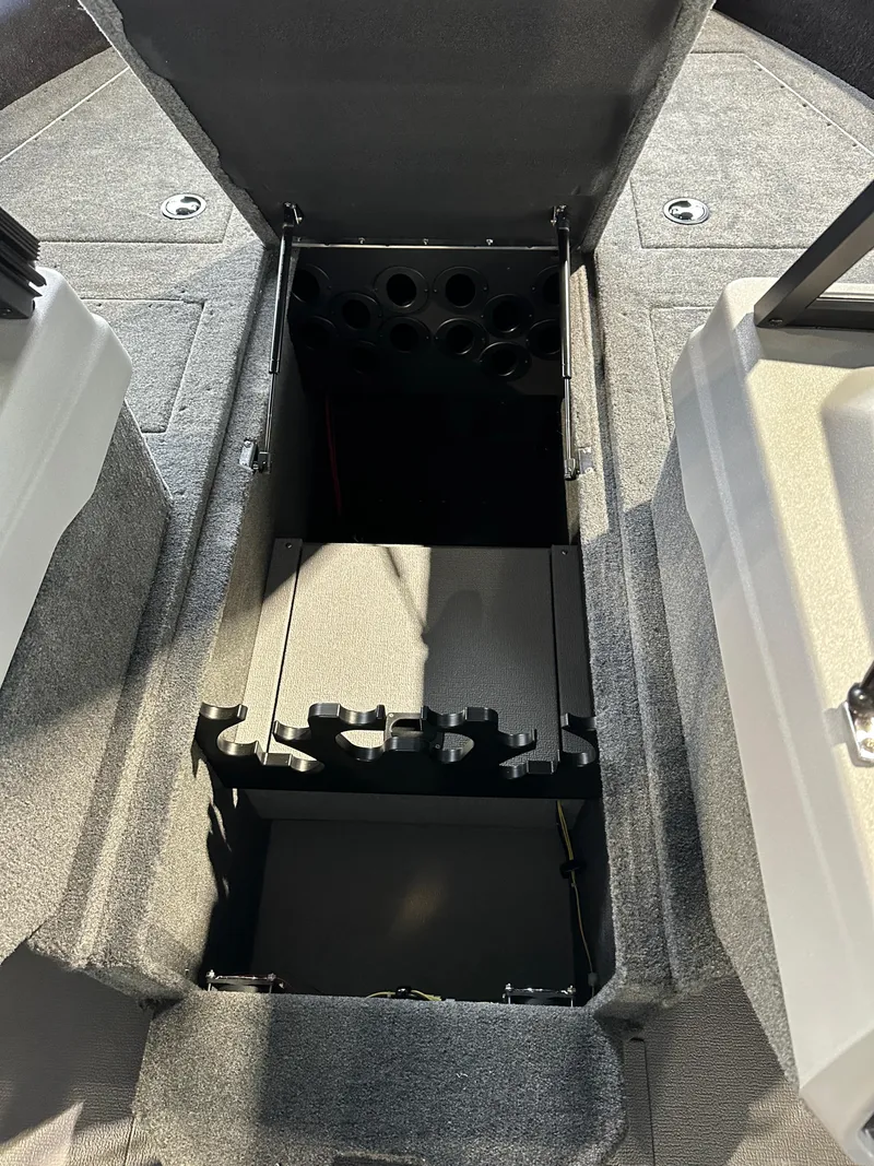 Slide: The Image of 2025 Smoker Craft Adventurer 188 DC boat storage compartment, open and empty. - 10