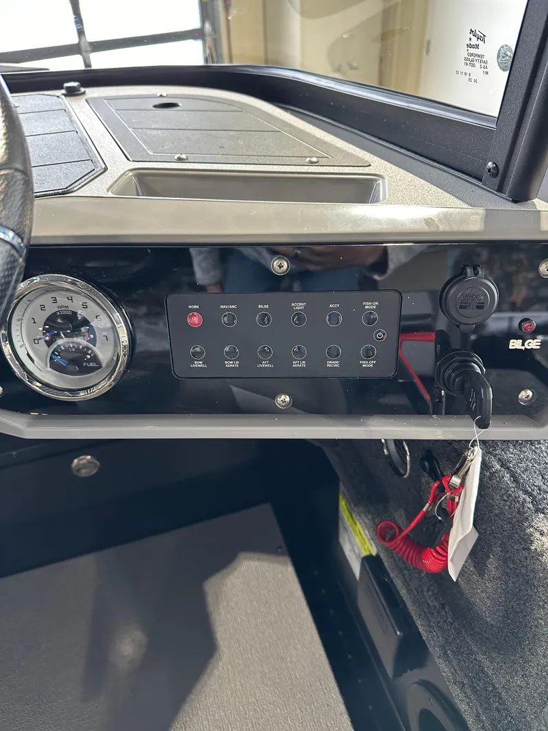 Slide: The Image of 2025 Smoker Craft Adventurer 188 DC dashboard with control panel and gauge. - 7