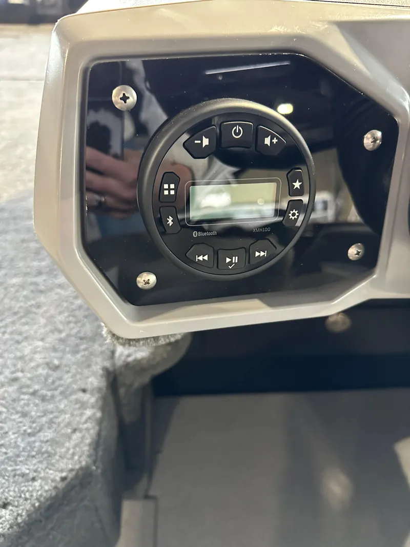 Slide: The Image of 2025 Smoker Craft Adventurer 188 DC boat control panel with digital display and buttons. - 8