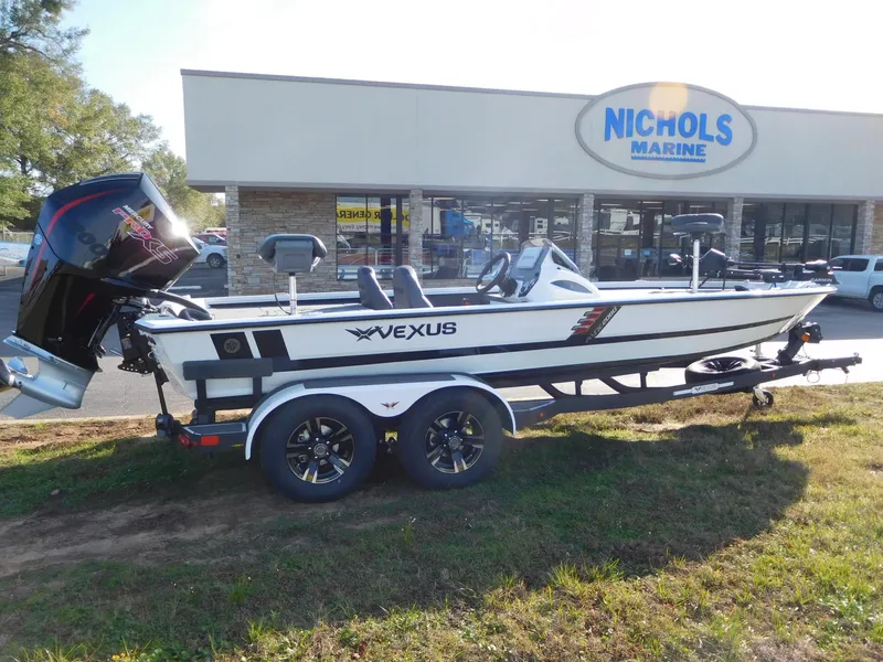 Slide: The Image of 2025 Vexus AVX 2080 boat on trailer outside Nichols Marine dealership. - 0