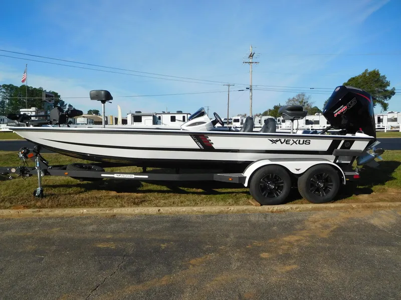 Slide: The Image of 2025 Vexus AVX 2080 boat on trailer, side view, outdoors. - 1