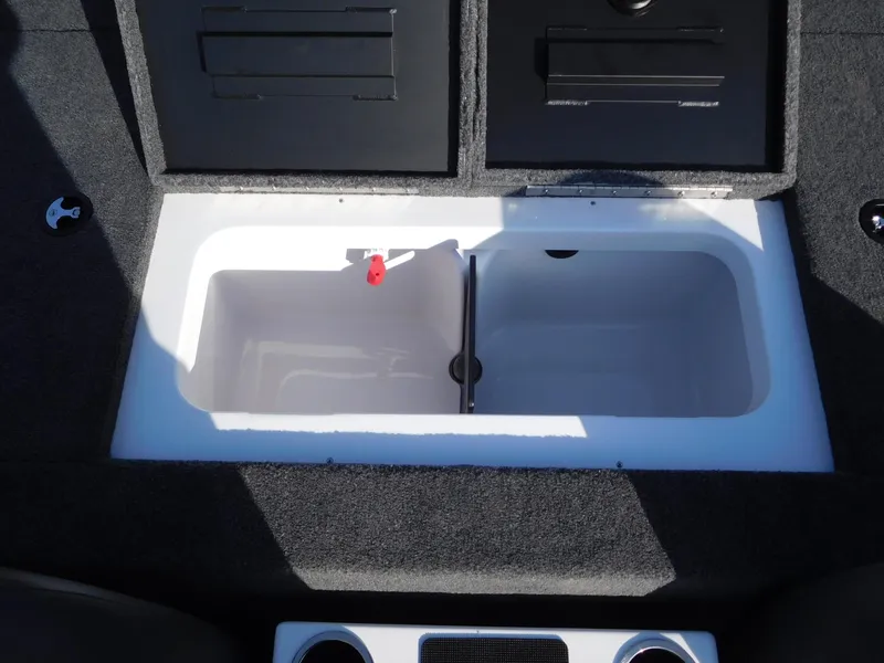 Slide: The Image of Vexus AVX 2080 2025 boat storage compartment with open lid, showcasing interior space. - 11