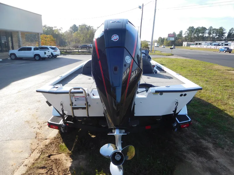 Slide: The Image of 2025 Vexus AVX 2080 boat with powerful outboard motor, parked outdoors. - 12