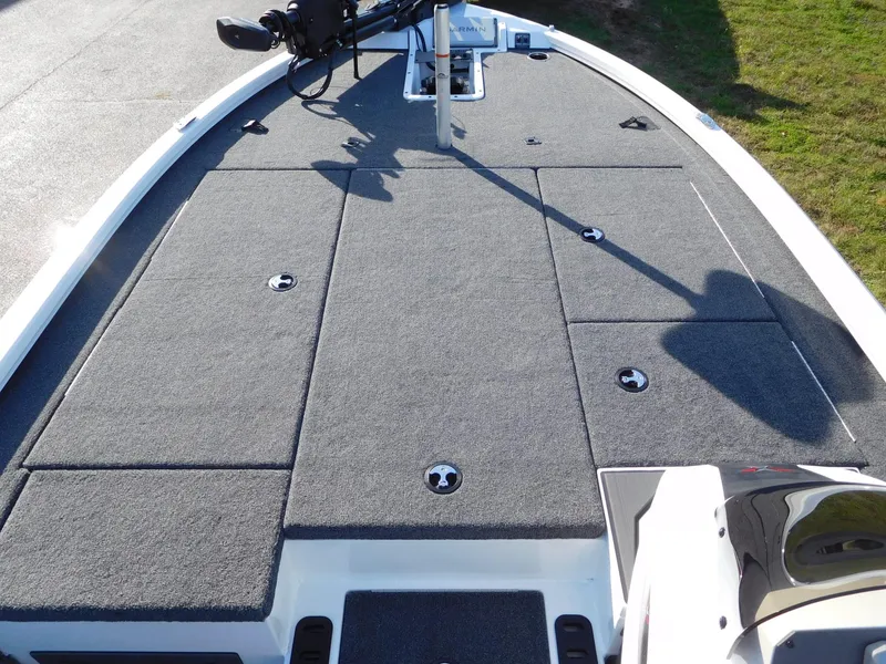 Slide: The Image of 2025 Vexus AVX 2080 boat deck with gray carpet and storage compartments. - 5