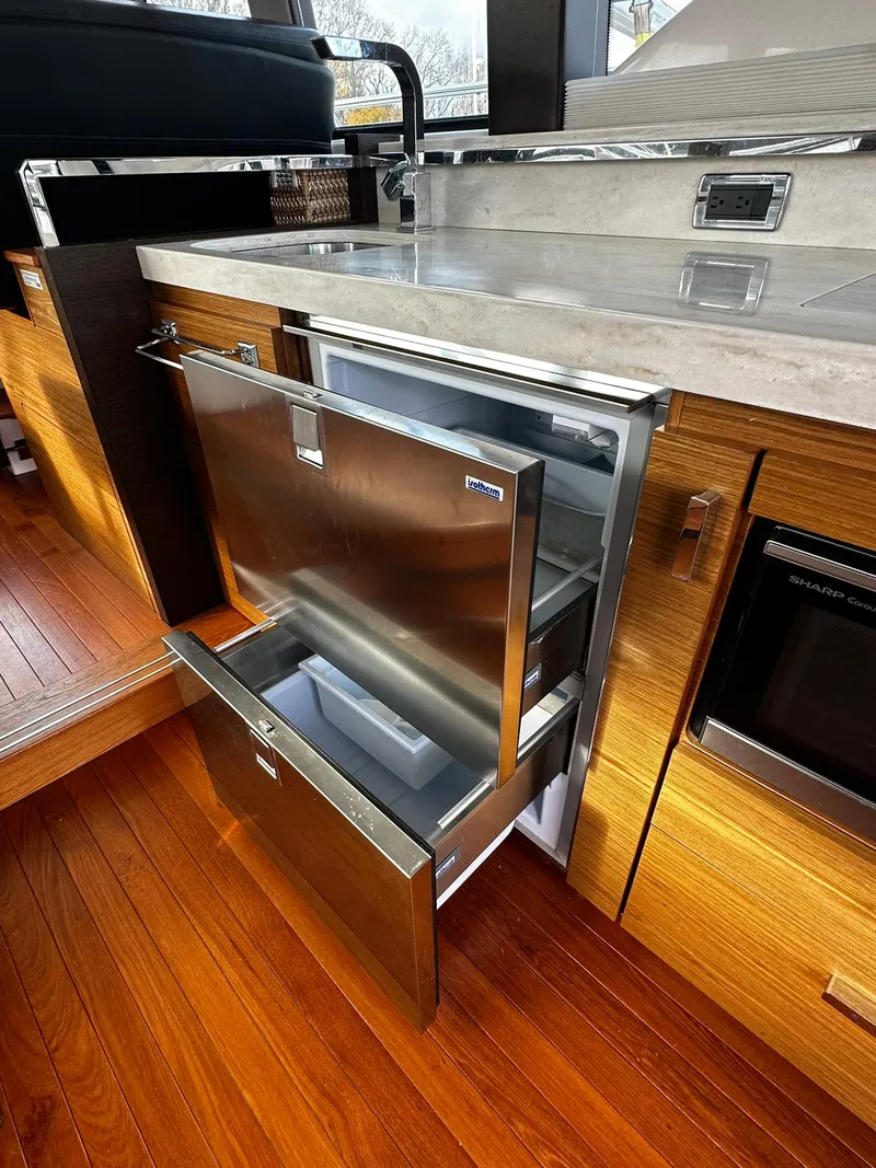 Slide: The Image of Modern kitchen in 2016 Tiara Yachts 49 COUPE with stainless steel appliances. - 11