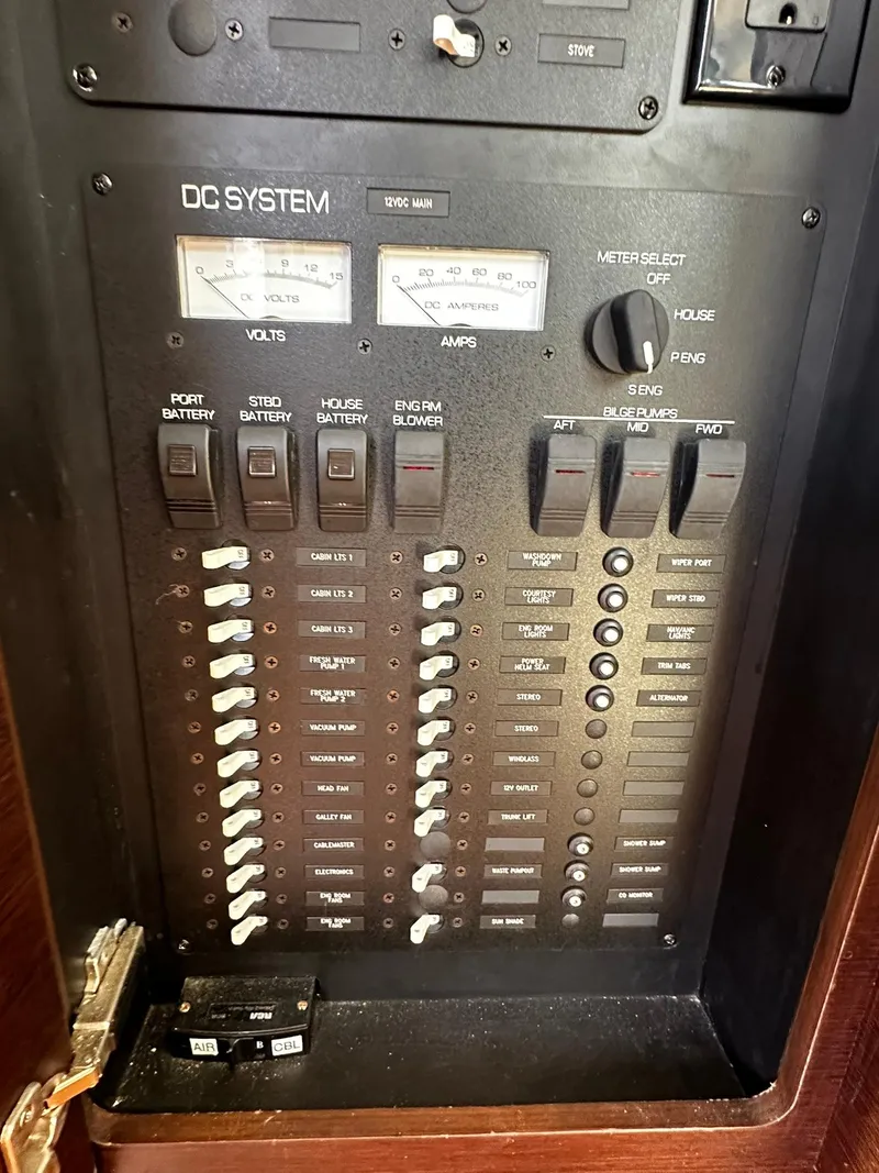 Slide: The Image of Control panel of 2016 Tiara Yachts 49 COUPE, featuring DC system switches and meters. - 14