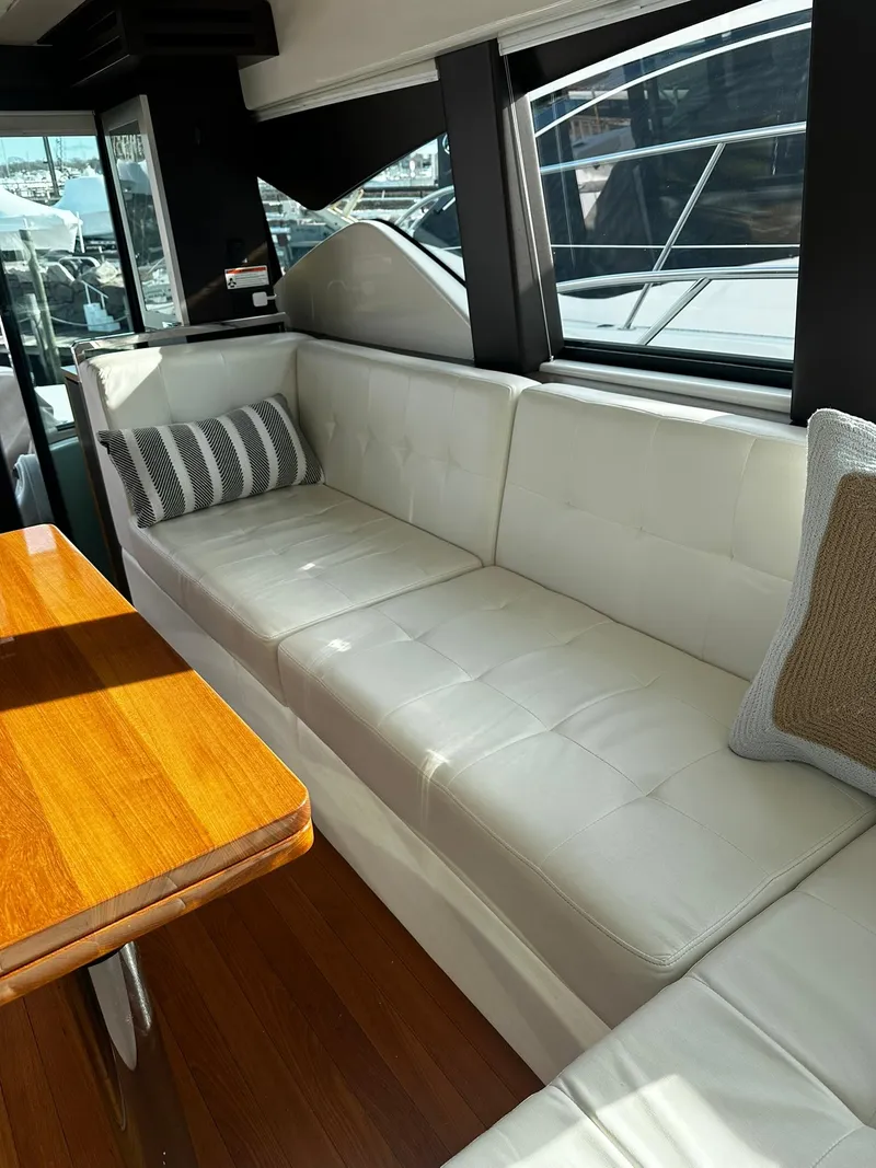 Slide: The Image of Luxurious interior of 2016 Tiara Yachts 49 COUPE with white leather seating. - 17