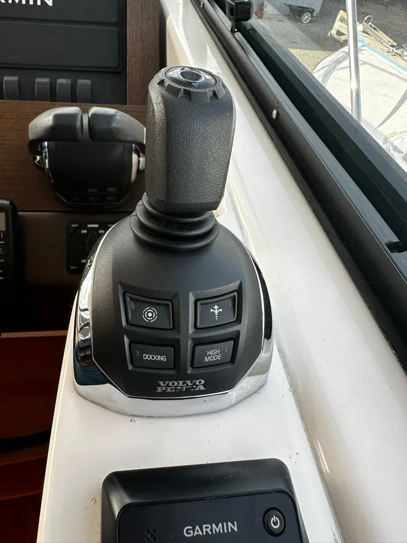 Slide: The Image of Joystick control on 2016 Tiara Yachts 49 COUPE, featuring Volvo Penta and Garmin systems. - 19