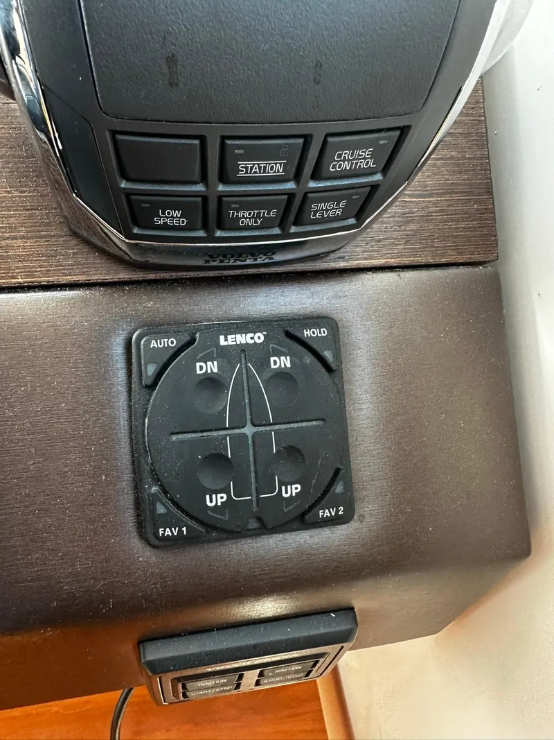 Slide: The Image of Control panel of 2016 Tiara Yachts 49 COUPE with Lenco trim tab switches. - 21