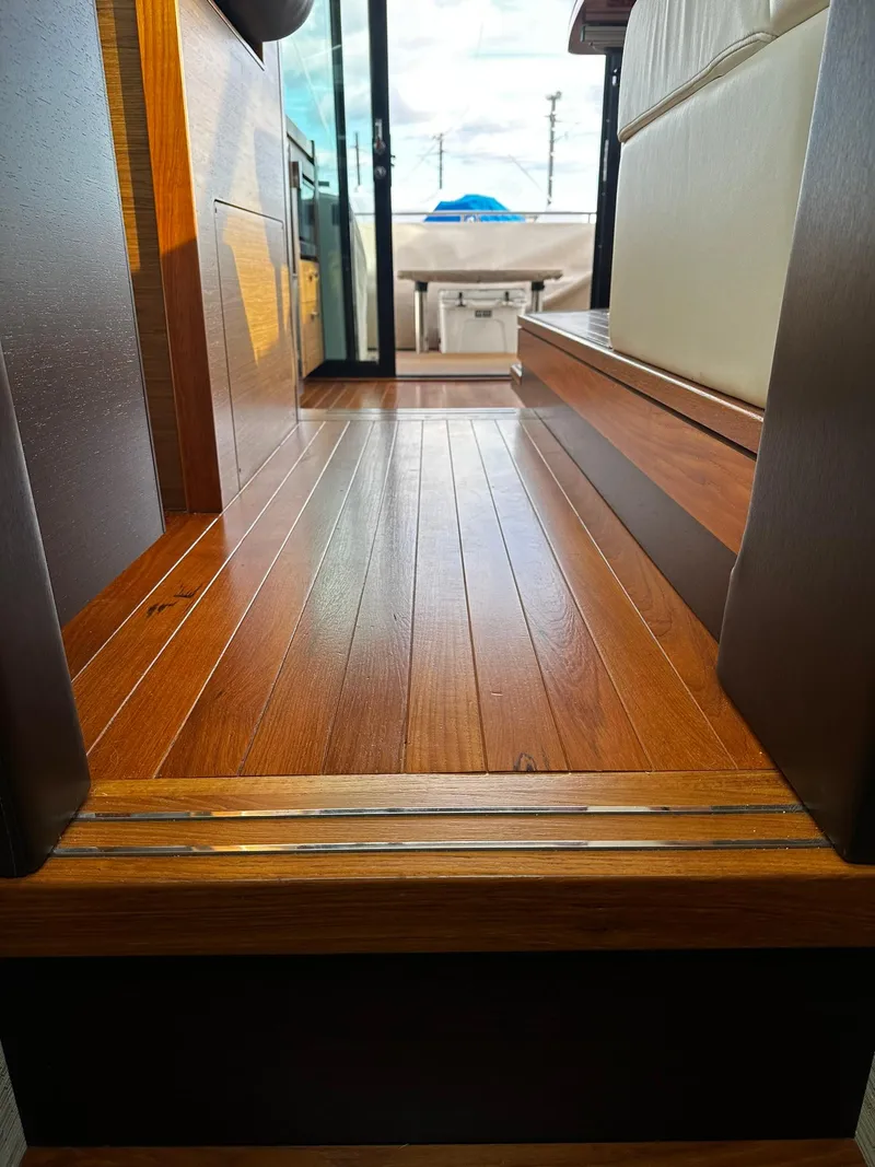 Slide: The Image of Interior view of 2016 Tiara Yachts 49 COUPE with wooden flooring. - 24
