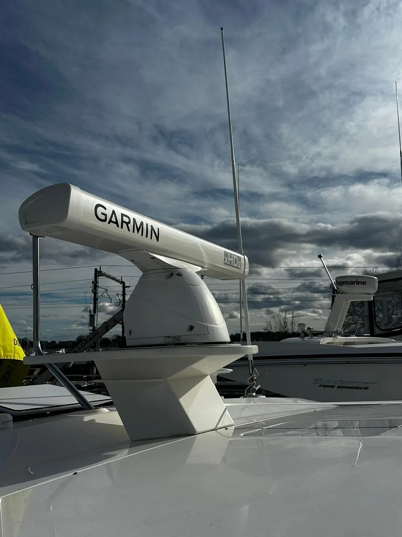 Slide: The Image of 2016 Tiara Yachts 49 COUPE with Garmin radar under cloudy sky. - 28