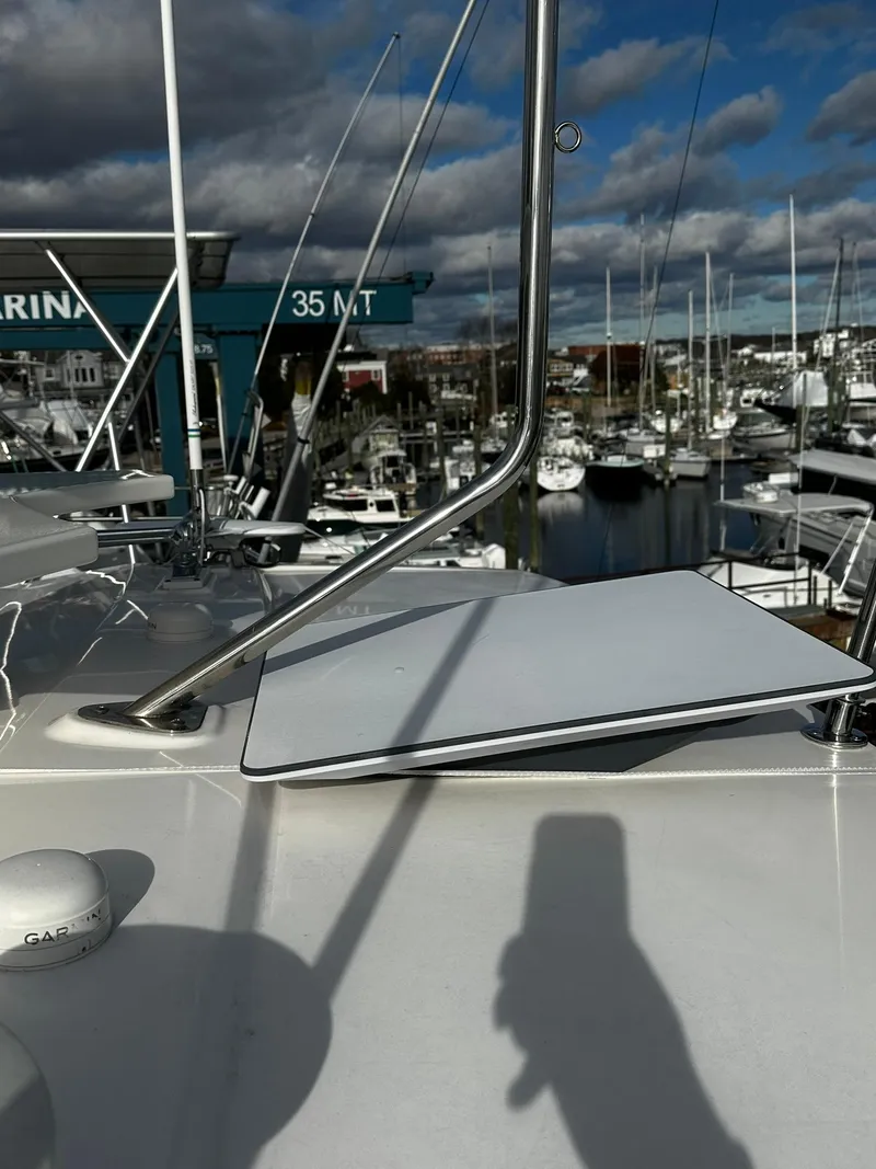 Slide: The Image of Tiara Yachts 2016 49 COUPE at marina, cloudy sky, boats in background. - 29