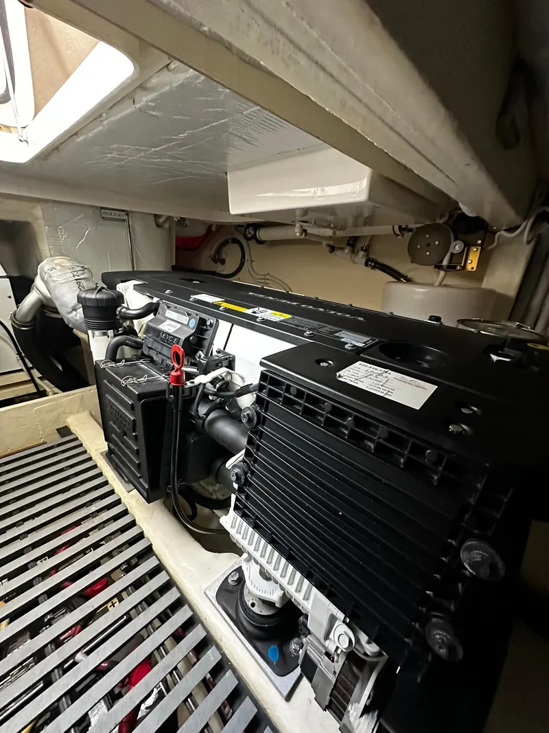Slide: The Image of Engine room of 2016 Tiara Yachts 49 COUPE, showcasing mechanical components. - 30