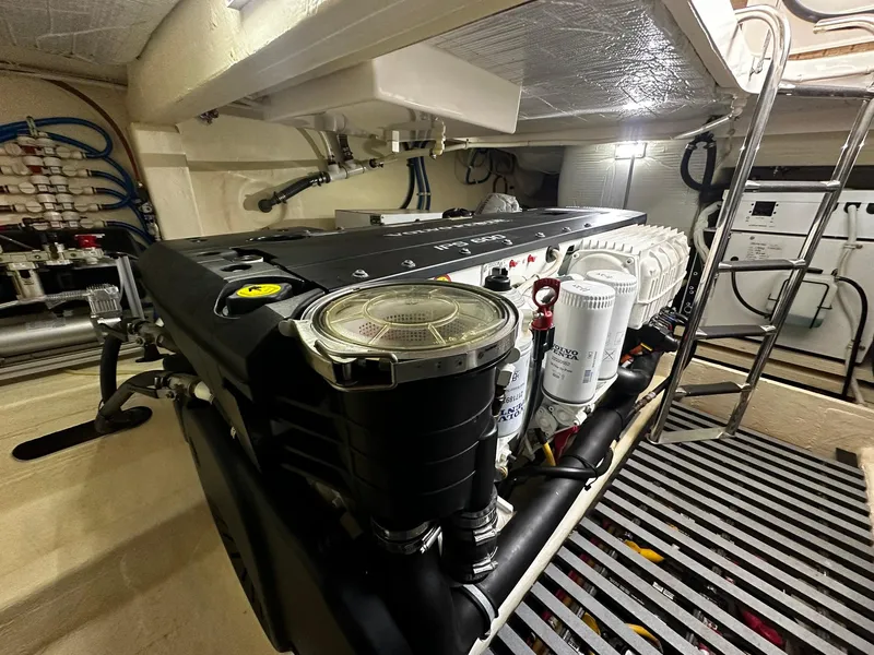 Slide: The Image of Engine room of 2016 Tiara Yachts 49 COUPE, showcasing mechanical components and systems. - 31