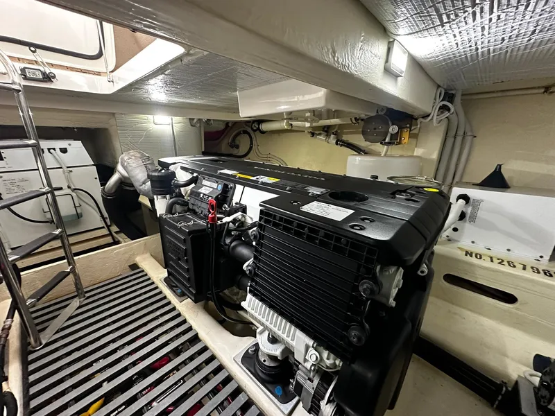 Slide: The Image of Engine room of 2016 Tiara Yachts 49 COUPE, showcasing modern equipment and design. - 32