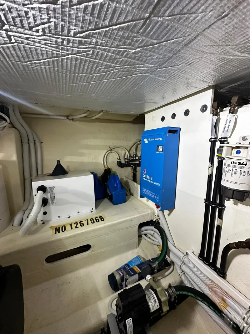 Slide: The Image of Engine room of 2016 Tiara Yachts 49 COUPE with electrical components and wiring. - 33