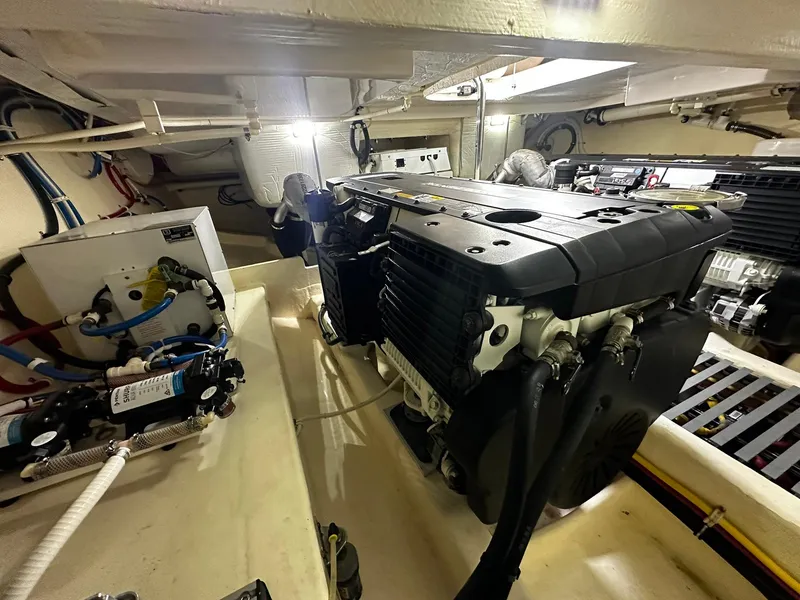 Slide: The Image of Engine room of 2016 Tiara Yachts 49 COUPE, showcasing machinery and components. - 34