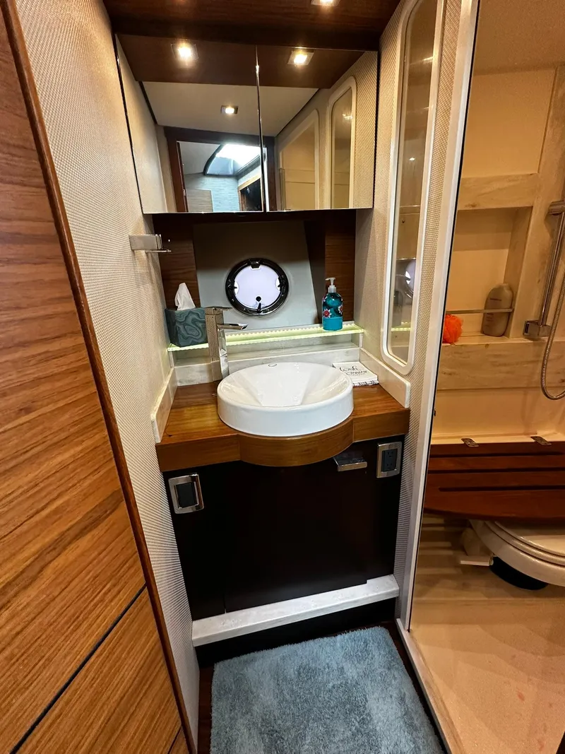 Slide: The Image of Luxurious bathroom in 2016 Tiara Yachts 49 COUPE with modern fixtures and elegant design. - 37