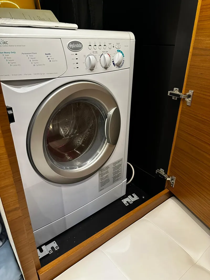 Slide: The Image of Washing machine inside Tiara Yachts 49 COUPE 2016, wooden cabinet enclosure. - 43