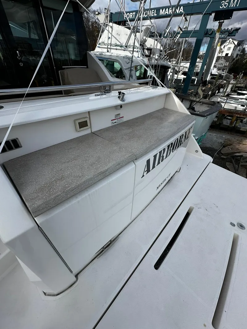 Slide: The Image of 2016 Tiara Yachts 49 COUPE at Port Michel Marina, rear deck view. - 48