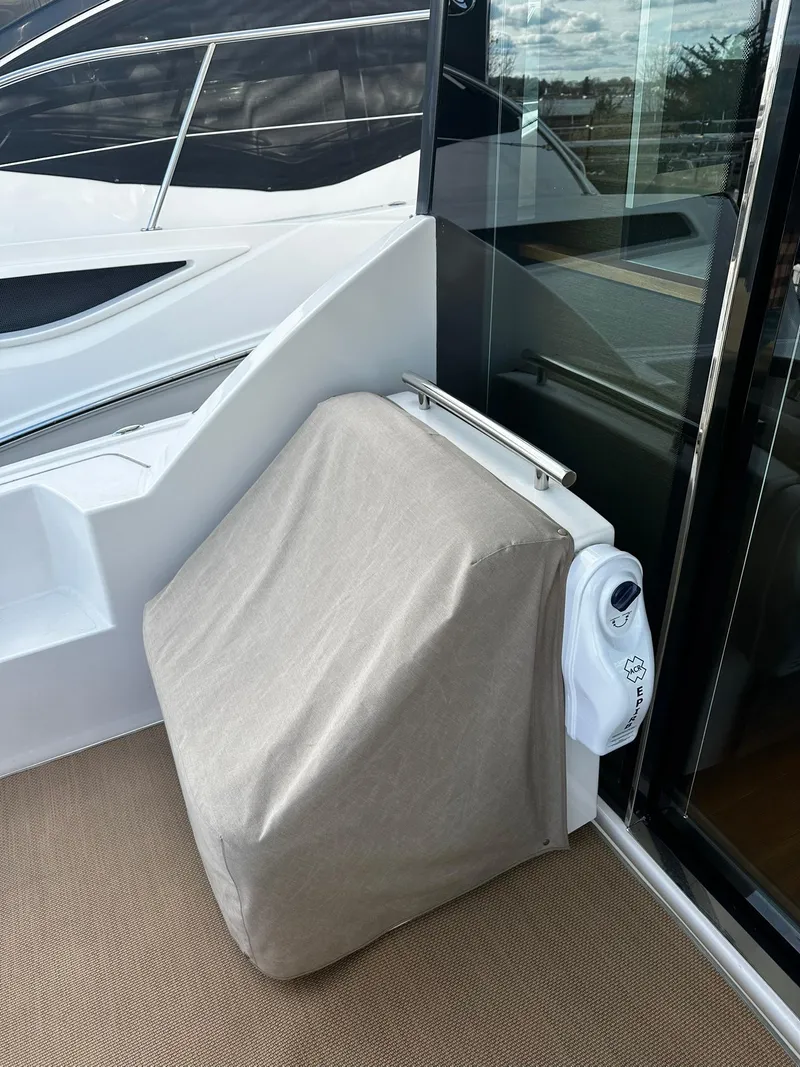 Slide: The Image of Covered equipment on 2016 Tiara Yachts 49 COUPE deck. - 6