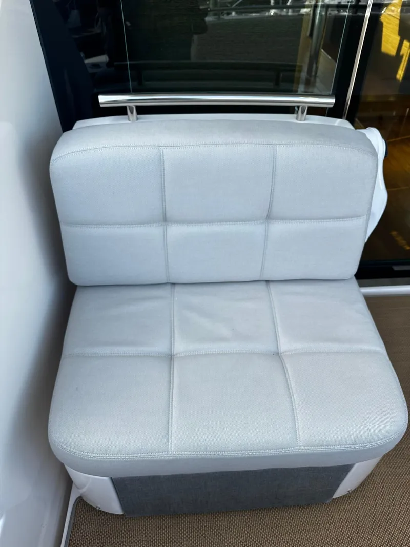 Slide: The Image of White cushioned seat on 2016 Tiara Yachts 49 COUPE. - 7