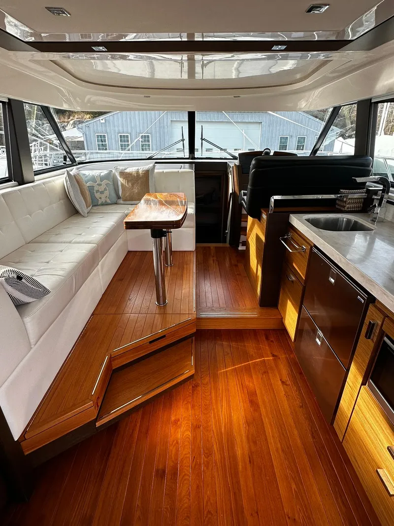 Slide: The Image of Luxurious interior of 2016 Tiara Yachts 49 COUPE with elegant wood flooring and modern furnishings. - 9