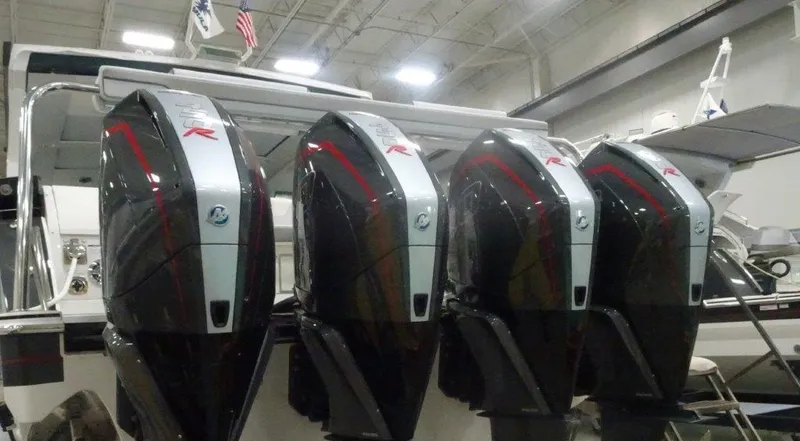Slide: The Image of Four powerful outboard motors on a 2021 Formula 430 Super Sport Crossover boat. - 10