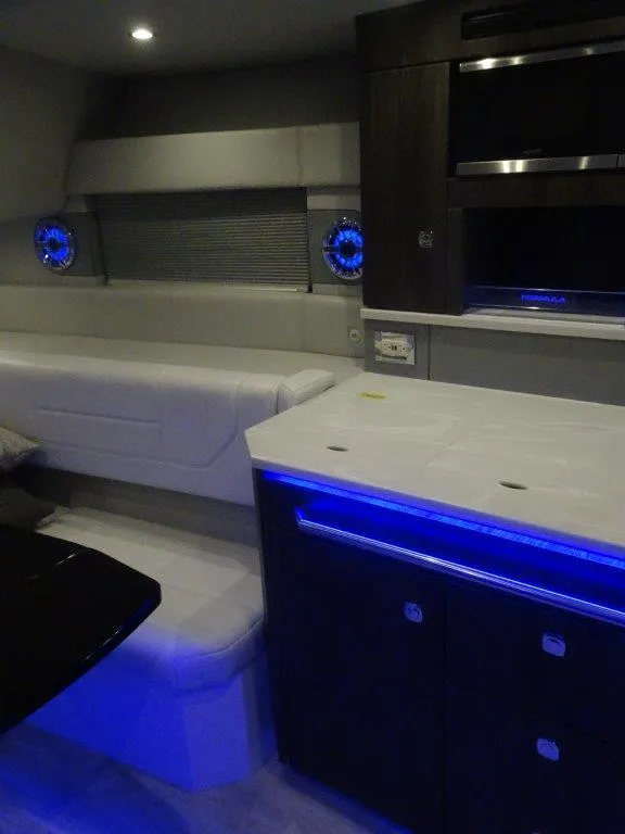 Slide: The Image of Interior of 2021 Formula 430 Super Sport Crossover with modern design and ambient lighting. - 12