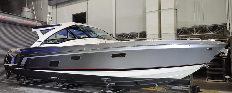Slide: The Image of 2021 Formula 430 Super Sport Crossover boat in a showroom setting. - 19