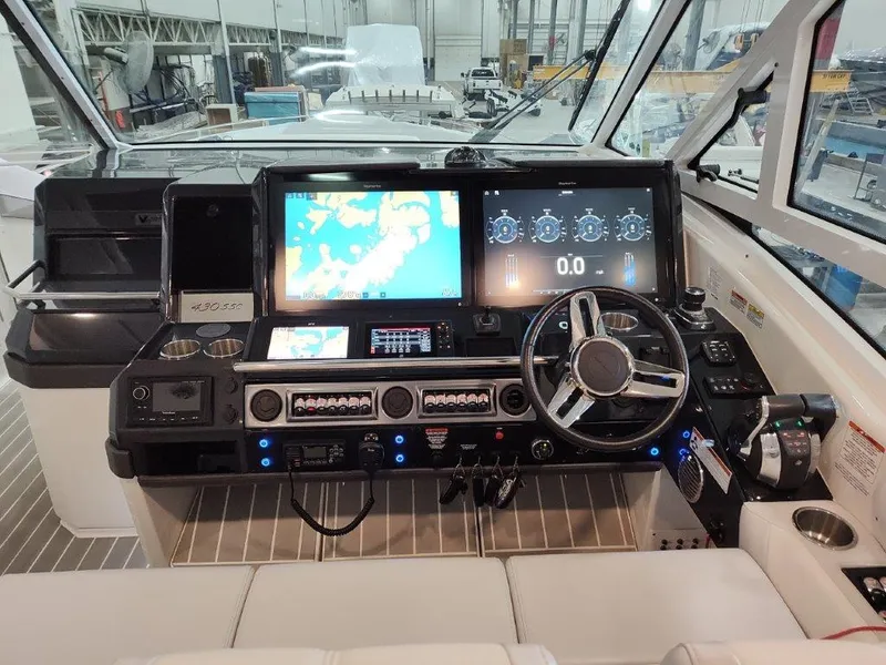 Slide: The Image of 2021 Formula 430 Super Sport Crossover helm with advanced navigation displays and controls. - 35