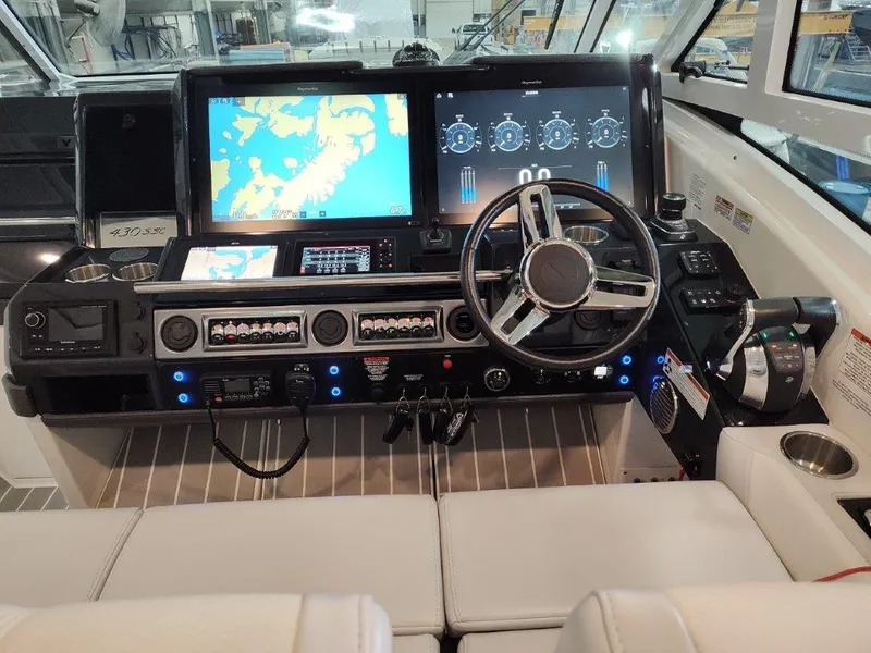 Slide: The Image of 2021 Formula 430 Super Sport Crossover helm with advanced navigation displays and controls. - 36
