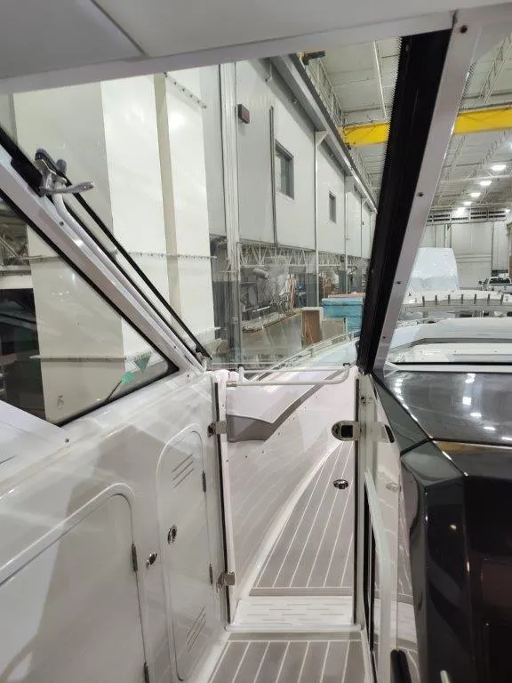 Slide: The Image of 2021 Formula 430 Super Sport Crossover interior in a warehouse setting. - 39