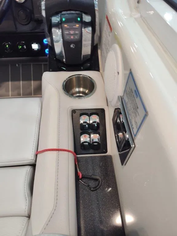 Slide: The Image of 2021 Formula 430 Super Sport Crossover boat interior with control panel and cup holder. - 41