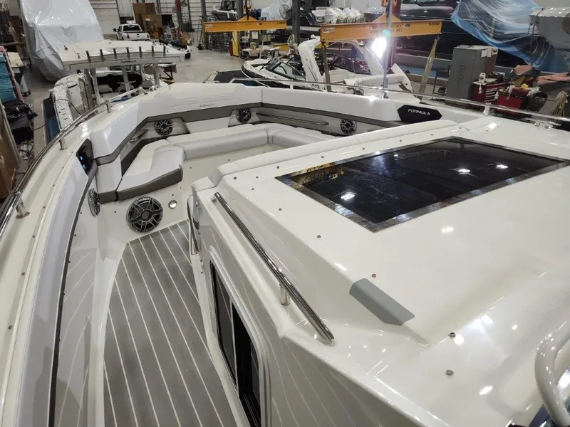 Slide: The Image of 2021 Formula 430 Super Sport Crossover boat interior in a showroom. - 48