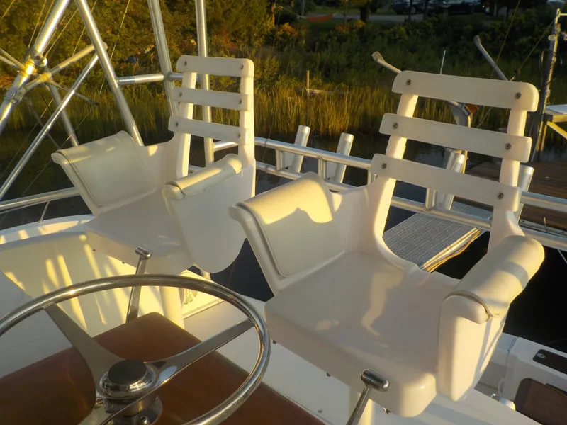 Slide: The Image of White captain chairs on 1996 Viking 47 Convertible yacht deck. - 15